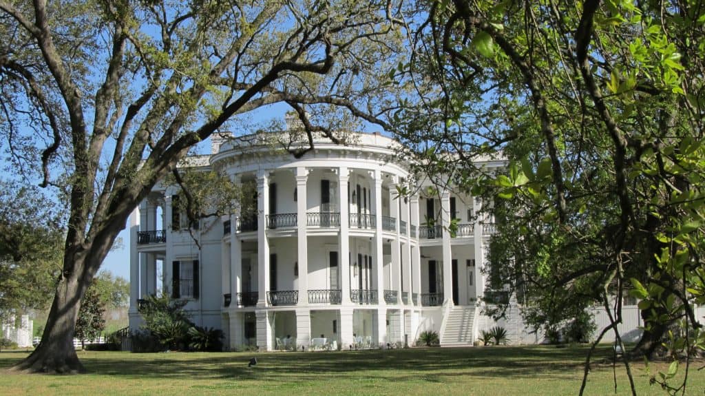 The front of Nottoway Plantation a large white building with a rounded front is one of the author's favorite historical places to visit.
