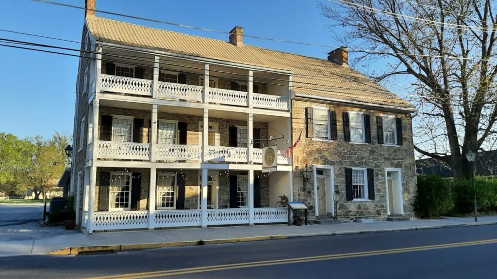 The Fairfield Inn, now called the Mansion House is a stone building with three balconies. It houses of the restaurants in Fairfield.