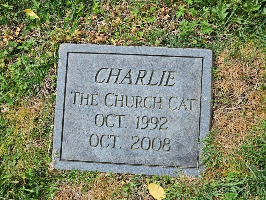 The tombstone of Charlie the church at at St. John's Church.