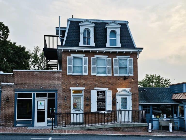 a tree story brick building with white shutters which is the haunted Gettysburg Orphanage.