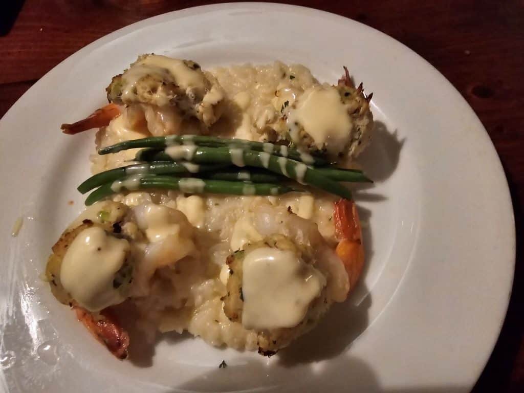 Stuff shrimp dish with asparagus on top.
