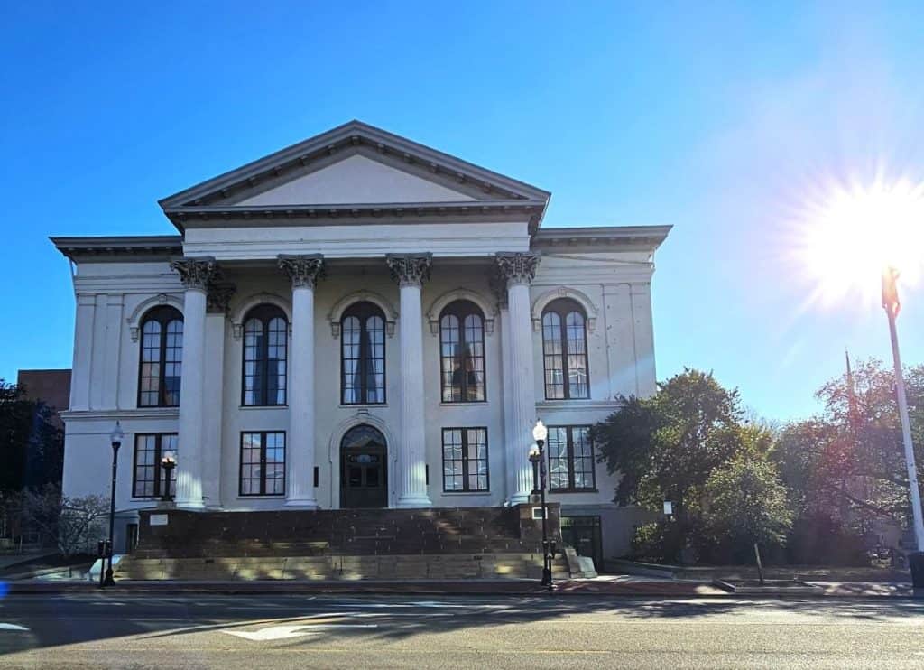 Thalien Hall is a stunning historical site in Wilmington NC, with four immense white columns on a two-story building.