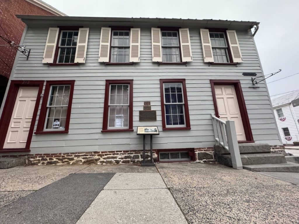 The Jennie Wade House, a gray house with red trim is one of the most haunted places to stay in Gettysburg.