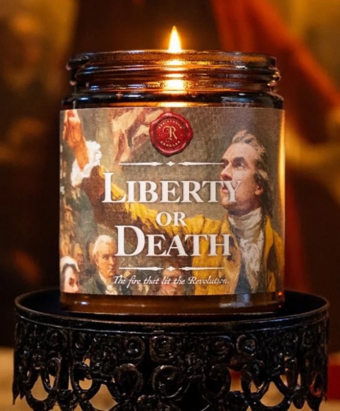 A candle in a jar that says liberty or death.